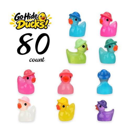 Tiny resin ducks in bright colors, each wearing a little hat